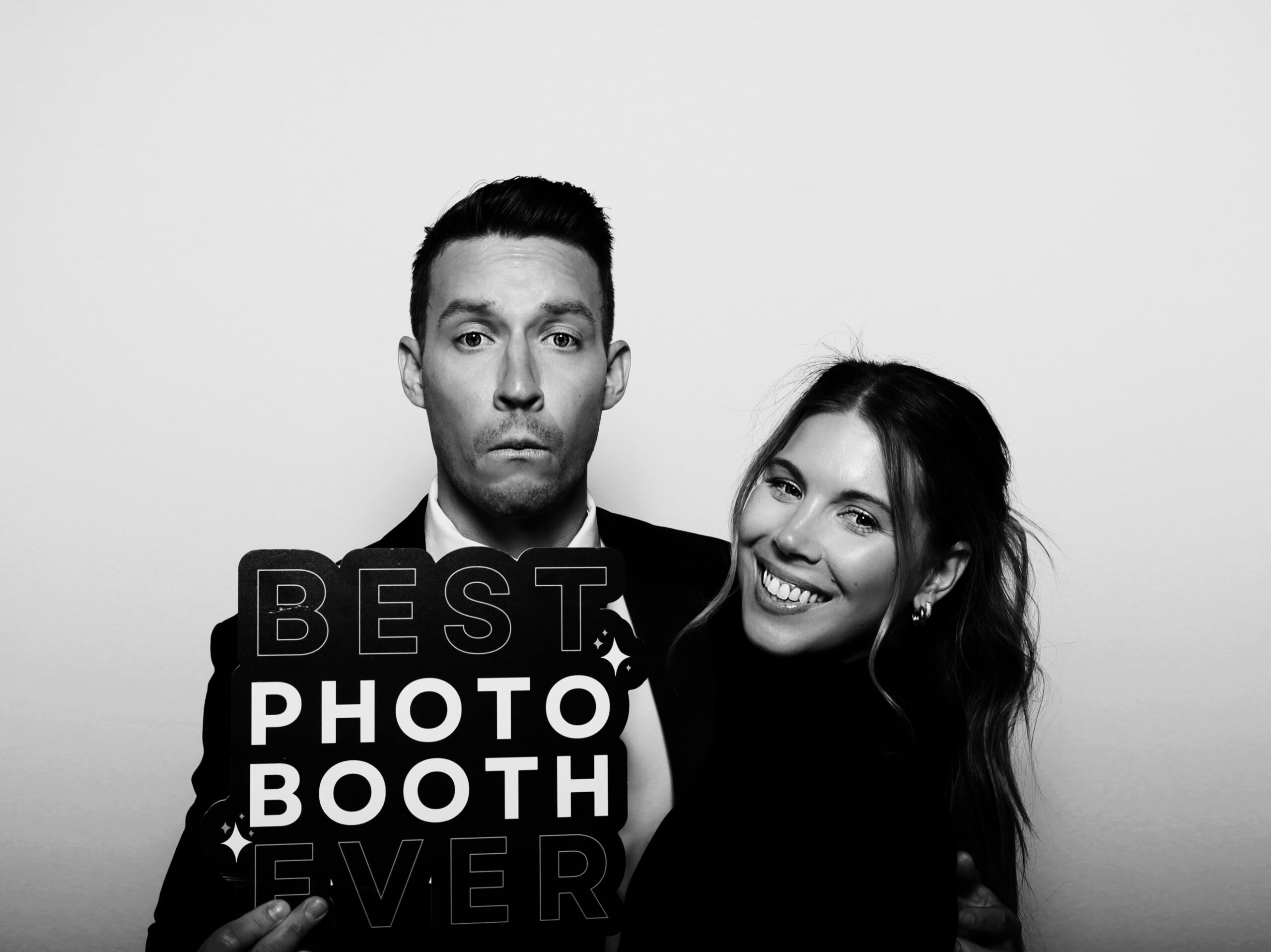 Candid wedding photo booth moment